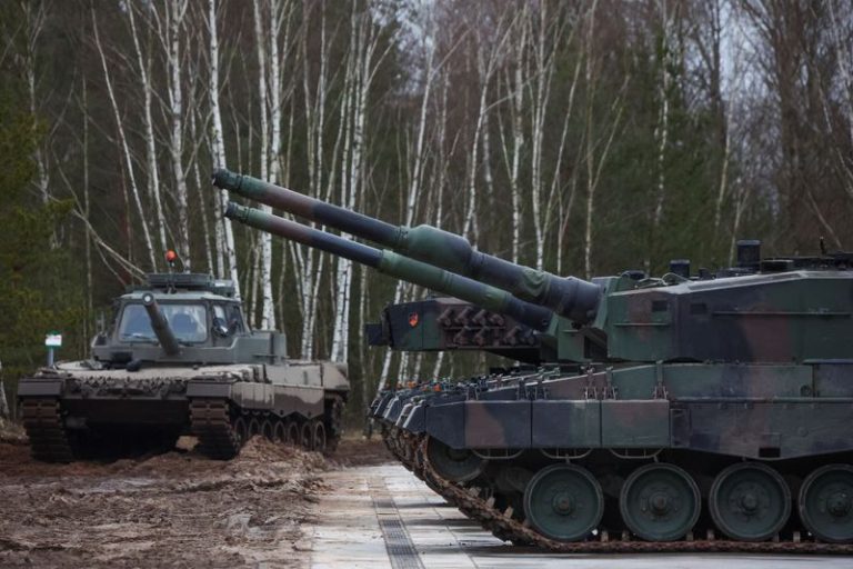 Analysis-Poland leads NATO on defence spend – but can it afford it?