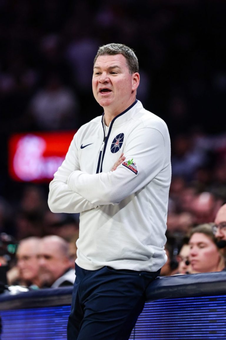 Arizona basketball coach Tommy Lloyd reacts to Utah firing Craig Smith